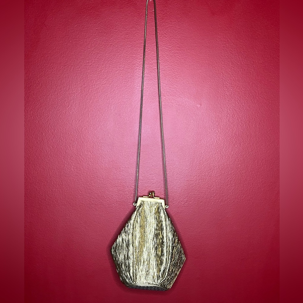 VINTAGE GOLD BAG! Love the slight coffin shape.